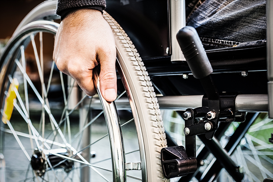 bigstock-Paralyzed-man-using-his-wheelc-64910623.jpg